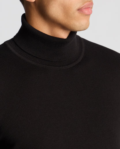 Man wearing a black Tapered Fit Roll Neck Sweater