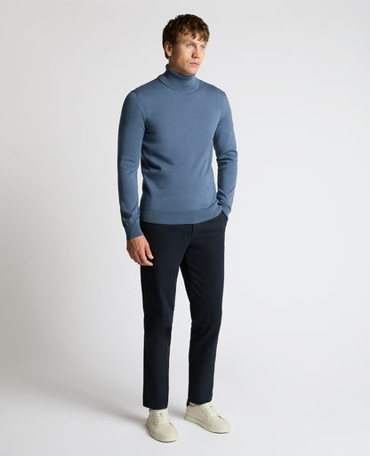 Man wearing a blue Roll Neck Cotton Sweater