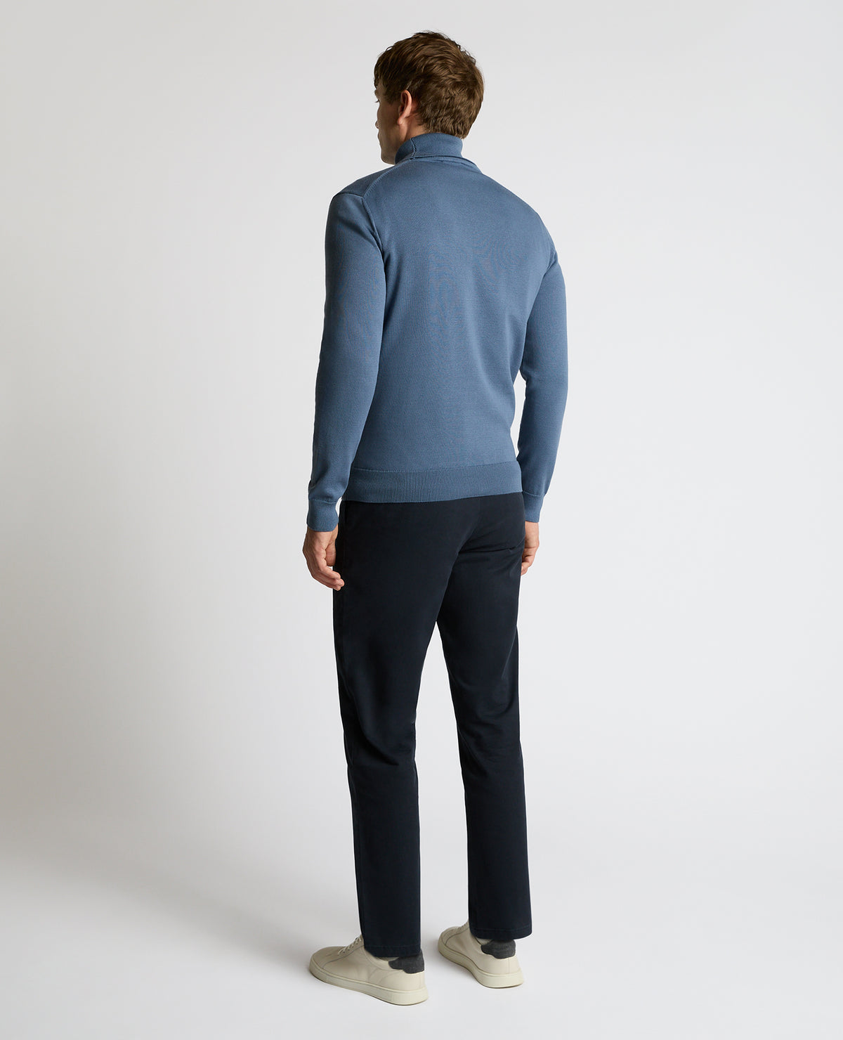 Man wearing a blue Roll Neck Cotton Sweater