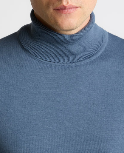 Man wearing a blue Roll Neck Cotton Sweater