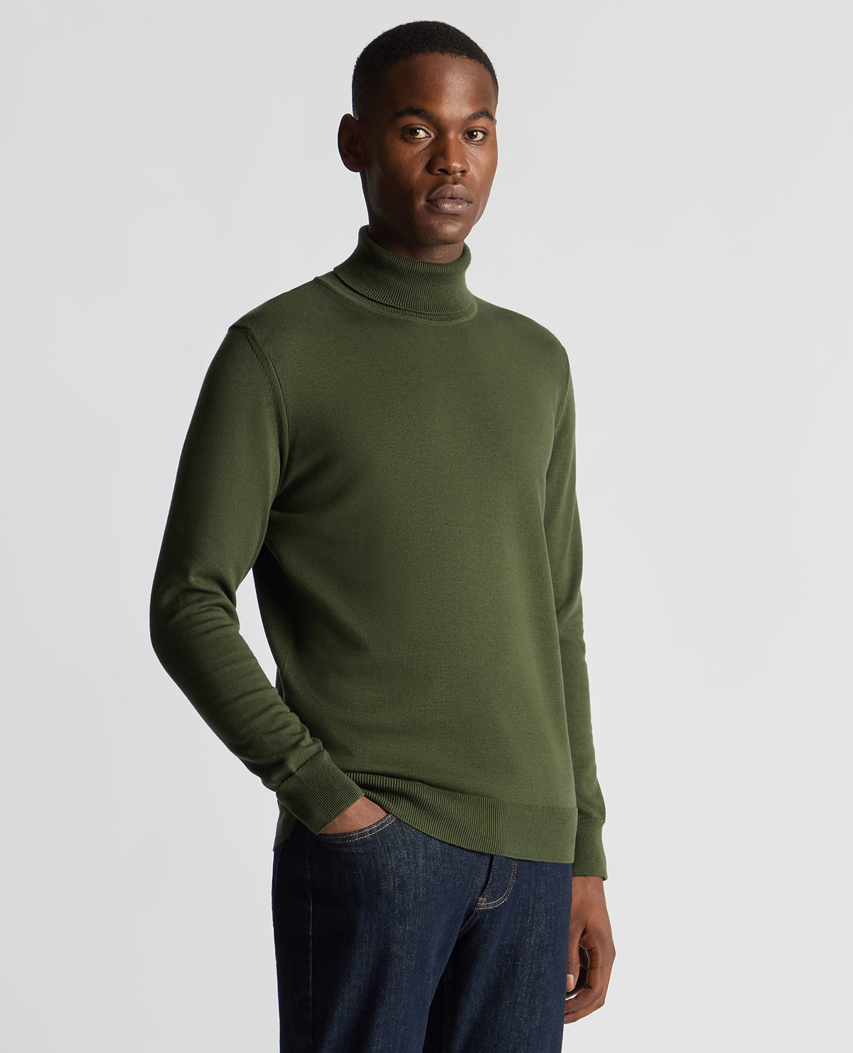Man wearing a green Tapered Fit Roll Neck Sweater
