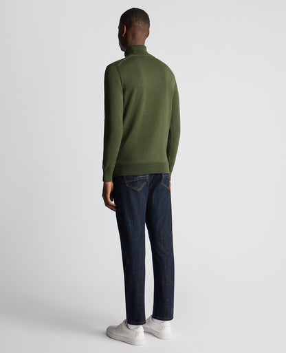 Man wearing a green Tapered Fit Roll Neck Sweater