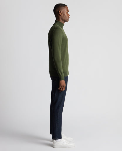 Man wearing a green Tapered Fit Roll Neck Sweater