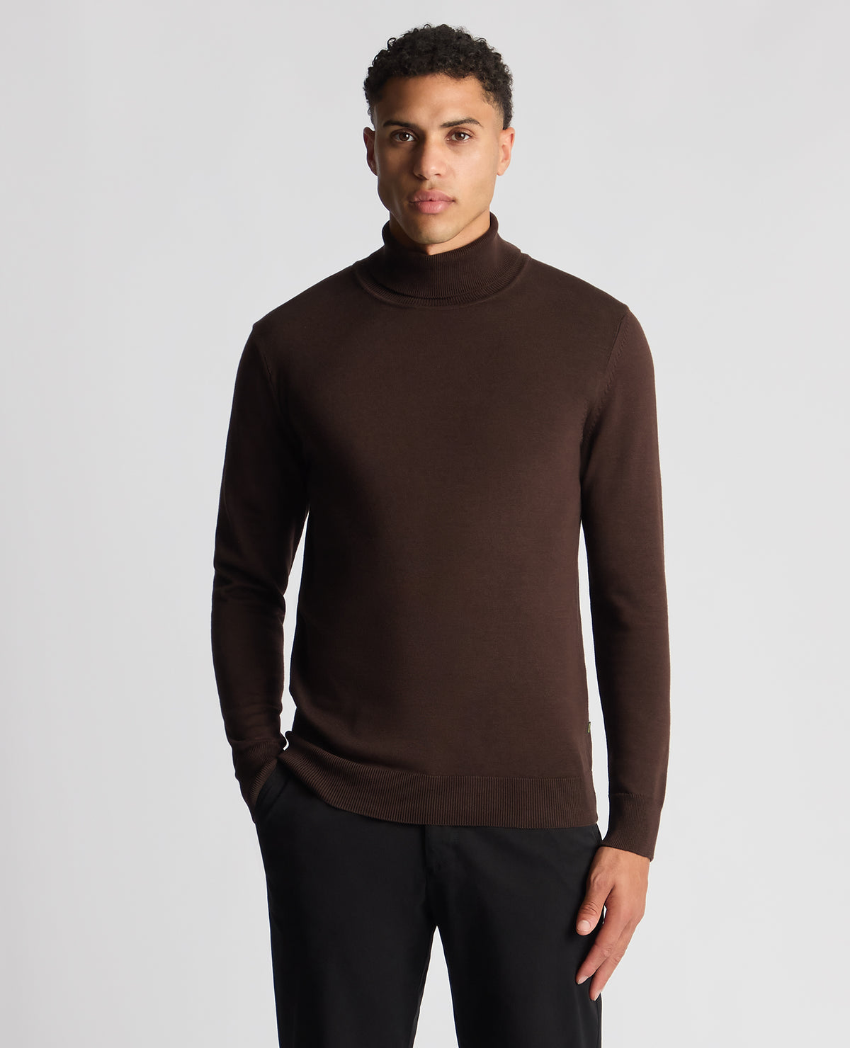 Man wearing a brown Tapered Fit Roll Neck Sweater