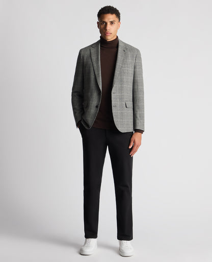 Man wearing a brown Tapered Fit Roll Neck Sweater