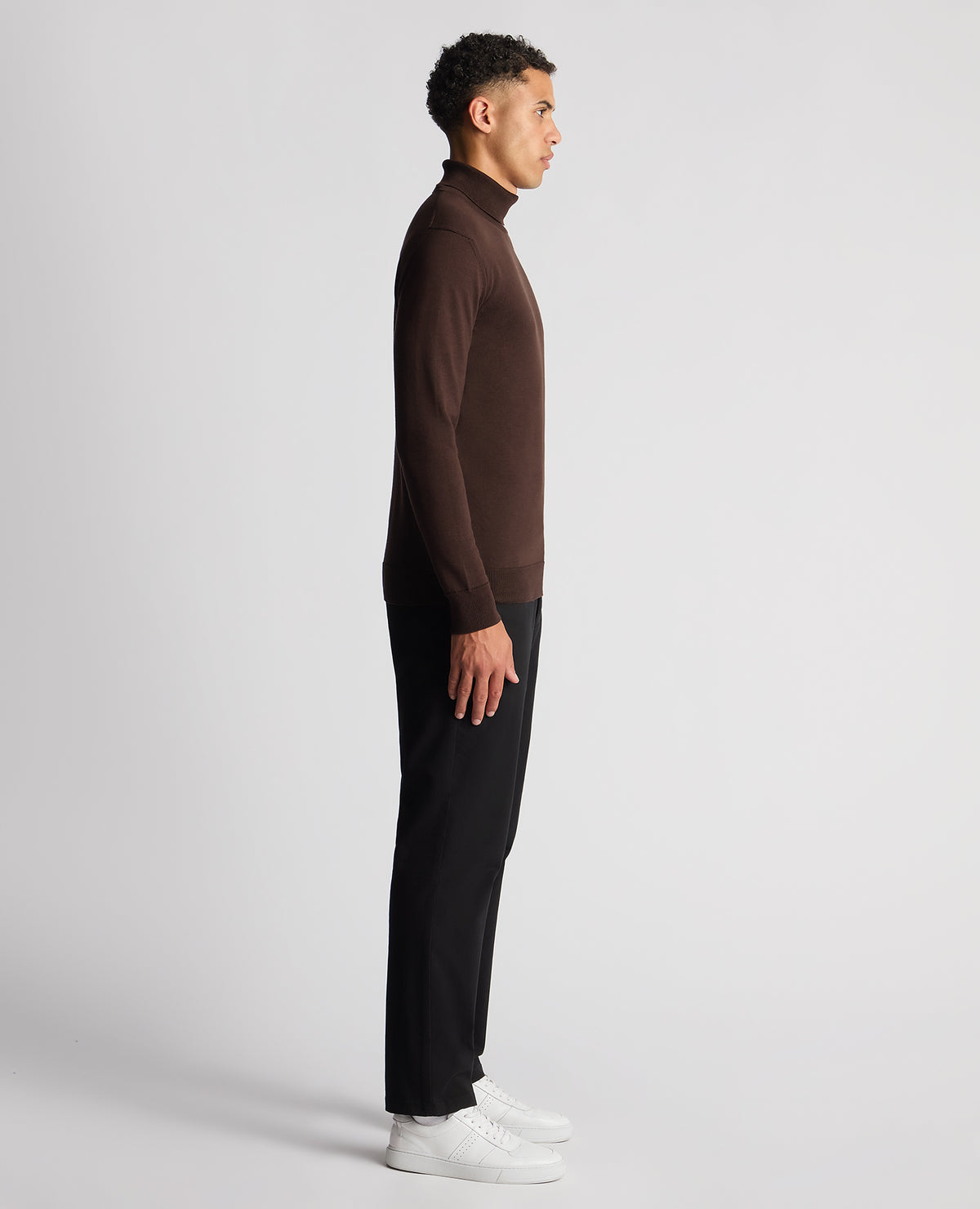 Man wearing a brown Tapered Fit Roll Neck Sweater