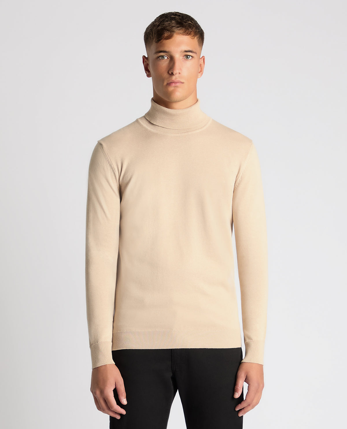 Man wearing a sand Tapered Fit Roll Neck Sweater