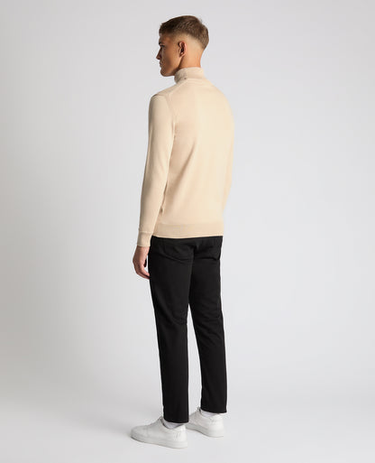 Man wearing a sand Tapered Fit Roll Neck Sweater