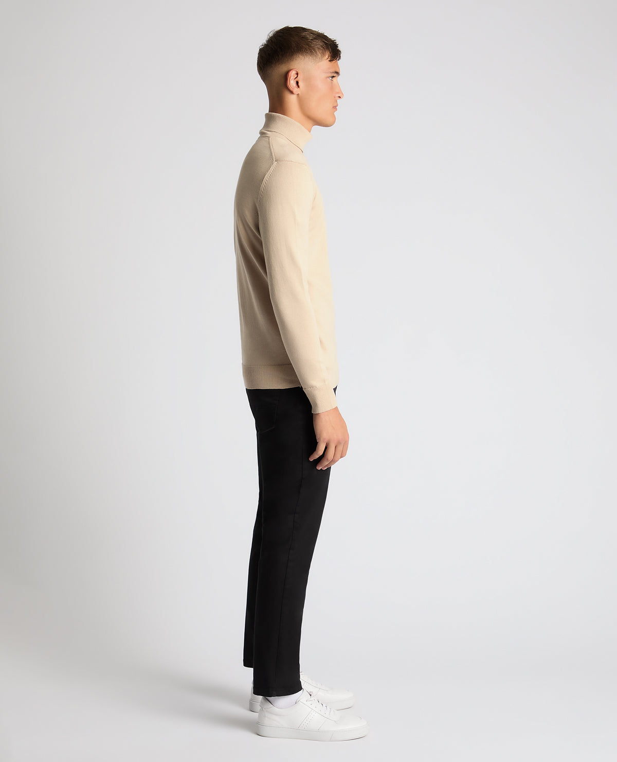 Man wearing a sand Tapered Fit Roll Neck Sweater