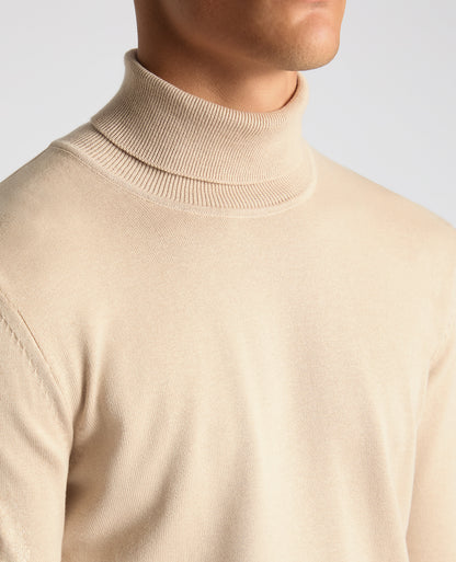 Man wearing a sand Tapered Fit Roll Neck Sweater