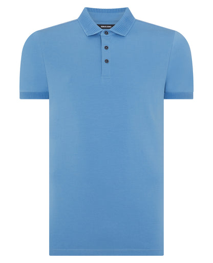 Man wearing a blue Tapered Fit Cotton-Stretch Polo Shirt
