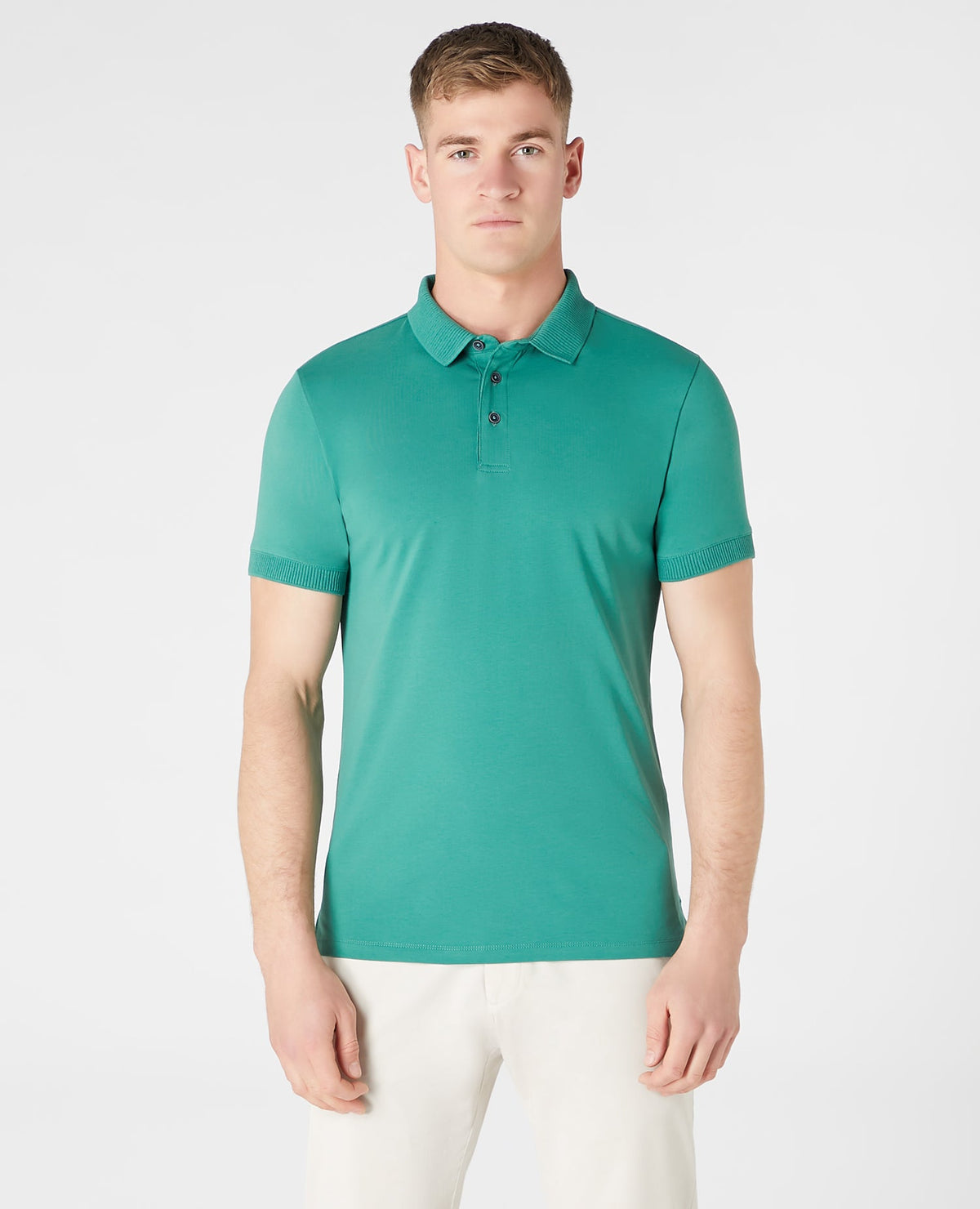 Man wearing a green Tapered Fit Cotton-Stretch Polo Shirt