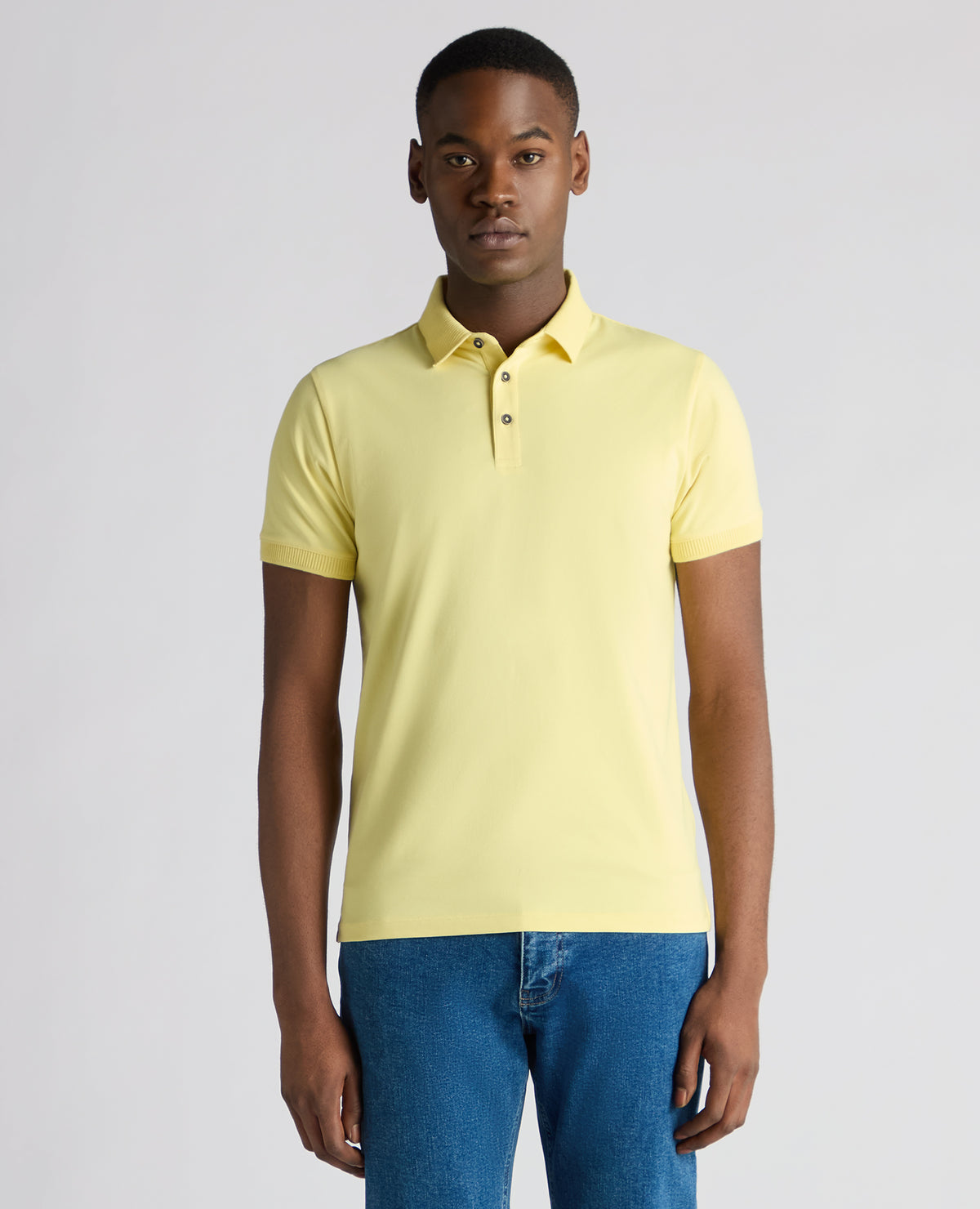 Man wearing a orange Tapered Fit Cotton-Stretch Polo Shirt