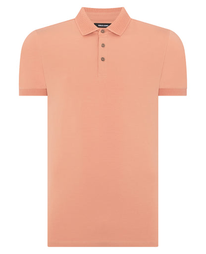 Man wearing a red Tapered Fit Cotton-Stretch Polo Shirt