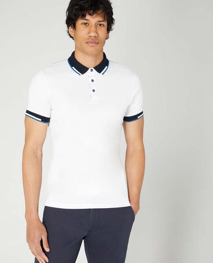 Man wearing a white Tapered Fit Cotton-Stretch Pique Polo Shirt