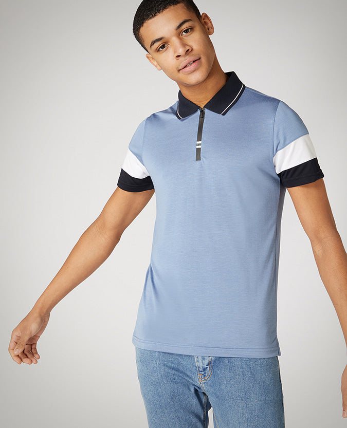 Man wearing a blue Tapered Fit Cotton-Stretch Jersey Polo Shirt