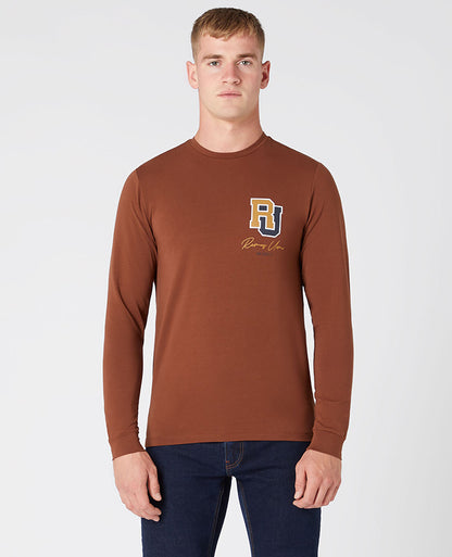 Man wearing a brown Tapered Fit Cotton-Stretch T-Shirt