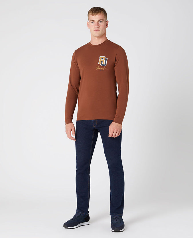Man wearing a brown Tapered Fit Cotton-Stretch T-Shirt