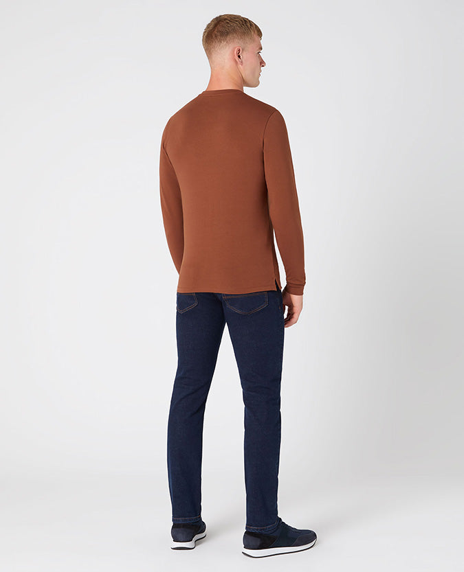 Man wearing a brown Tapered Fit Cotton-Stretch T-Shirt