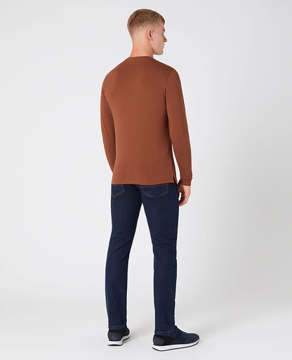 Man wearing a brown Tapered Fit Cotton-Stretch T-Shirt