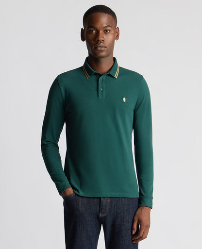 Man wearing a green Slim Fit Cotton-Stretch Pique Polo Shirt