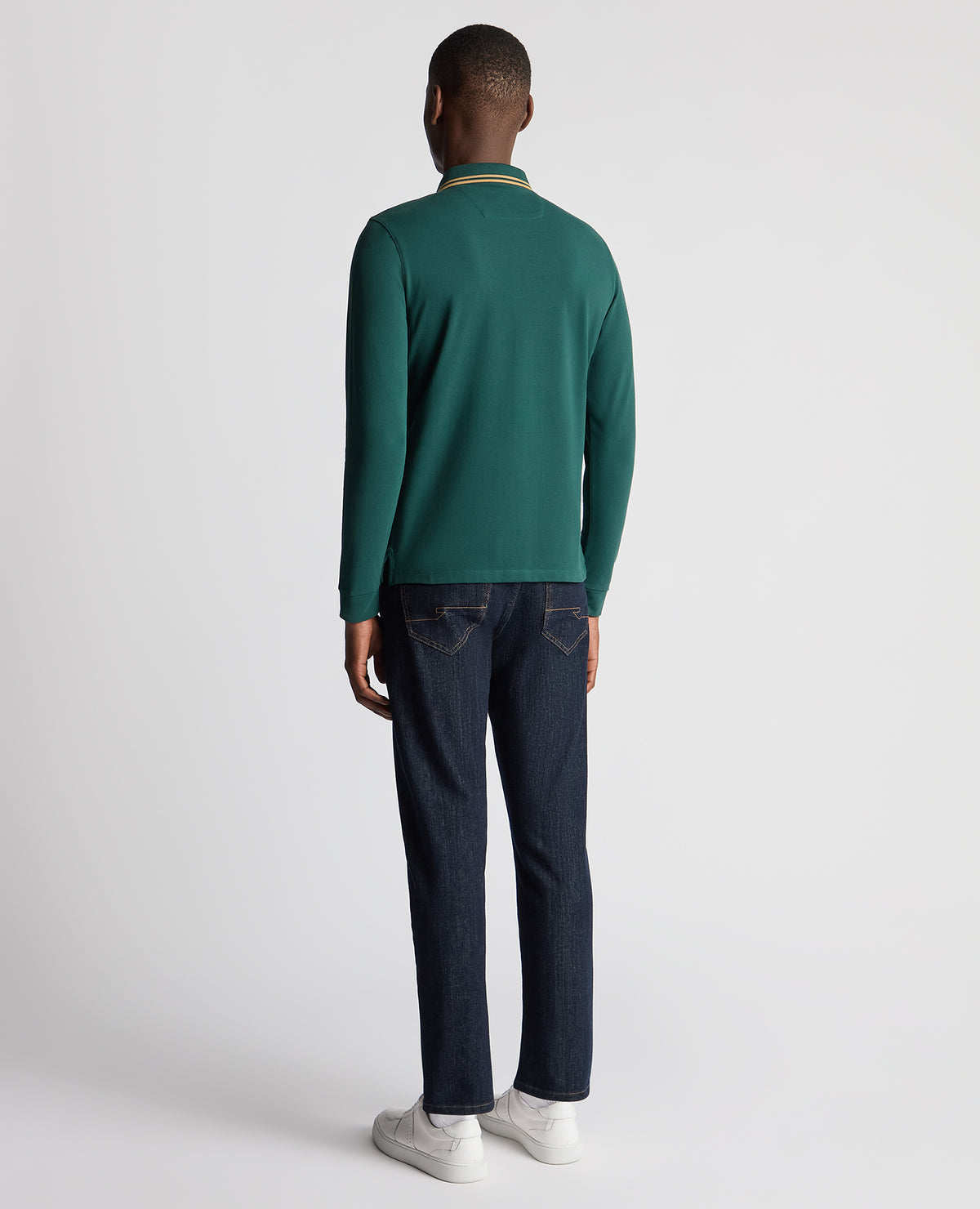 Man wearing a green Slim Fit Cotton-Stretch Pique Polo Shirt