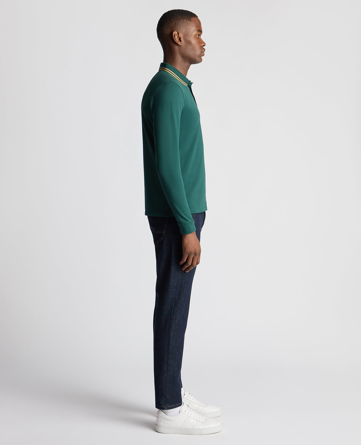 Man wearing a green Slim Fit Cotton-Stretch Pique Polo Shirt