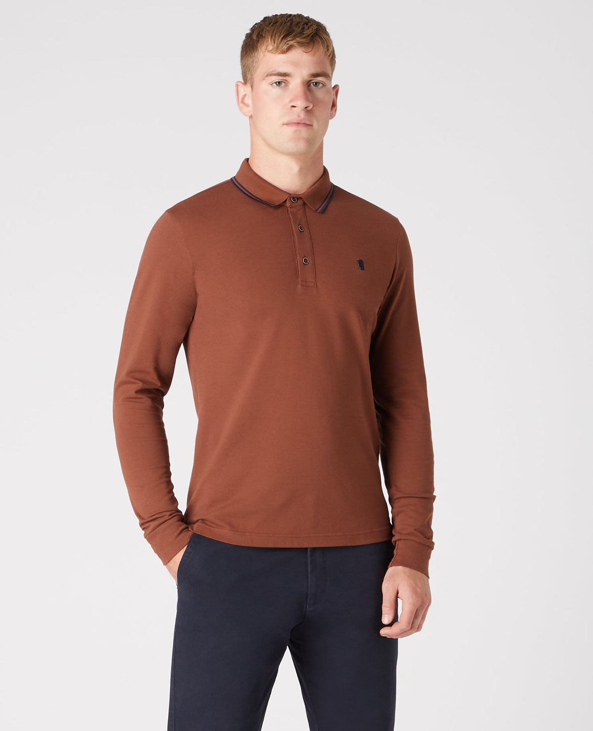 Man wearing a brown Slim Fit Cotton-Stretch Pique Polo Shirt