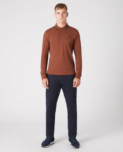 Man wearing a brown Slim Fit Cotton-Stretch Pique Polo Shirt