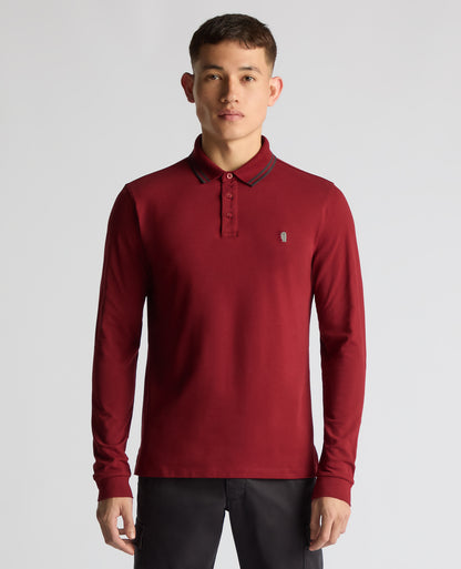 Man wearing a red Slim Fit Cotton-Stretch Pique Polo Shirt