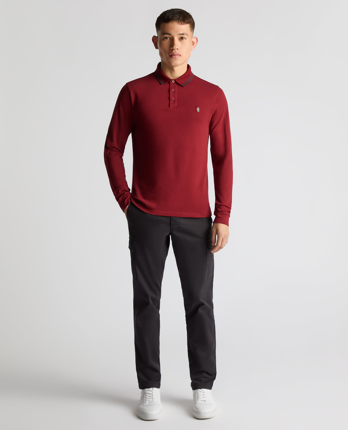 Man wearing a red Slim Fit Cotton-Stretch Pique Polo Shirt