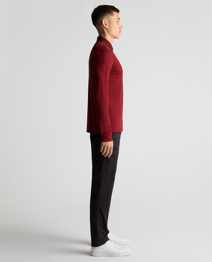 Man wearing a red Slim Fit Cotton-Stretch Pique Polo Shirt
