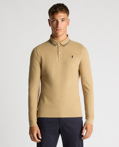 Man wearing a sand Slim Fit Cotton-Stretch Pique Polo Shirt