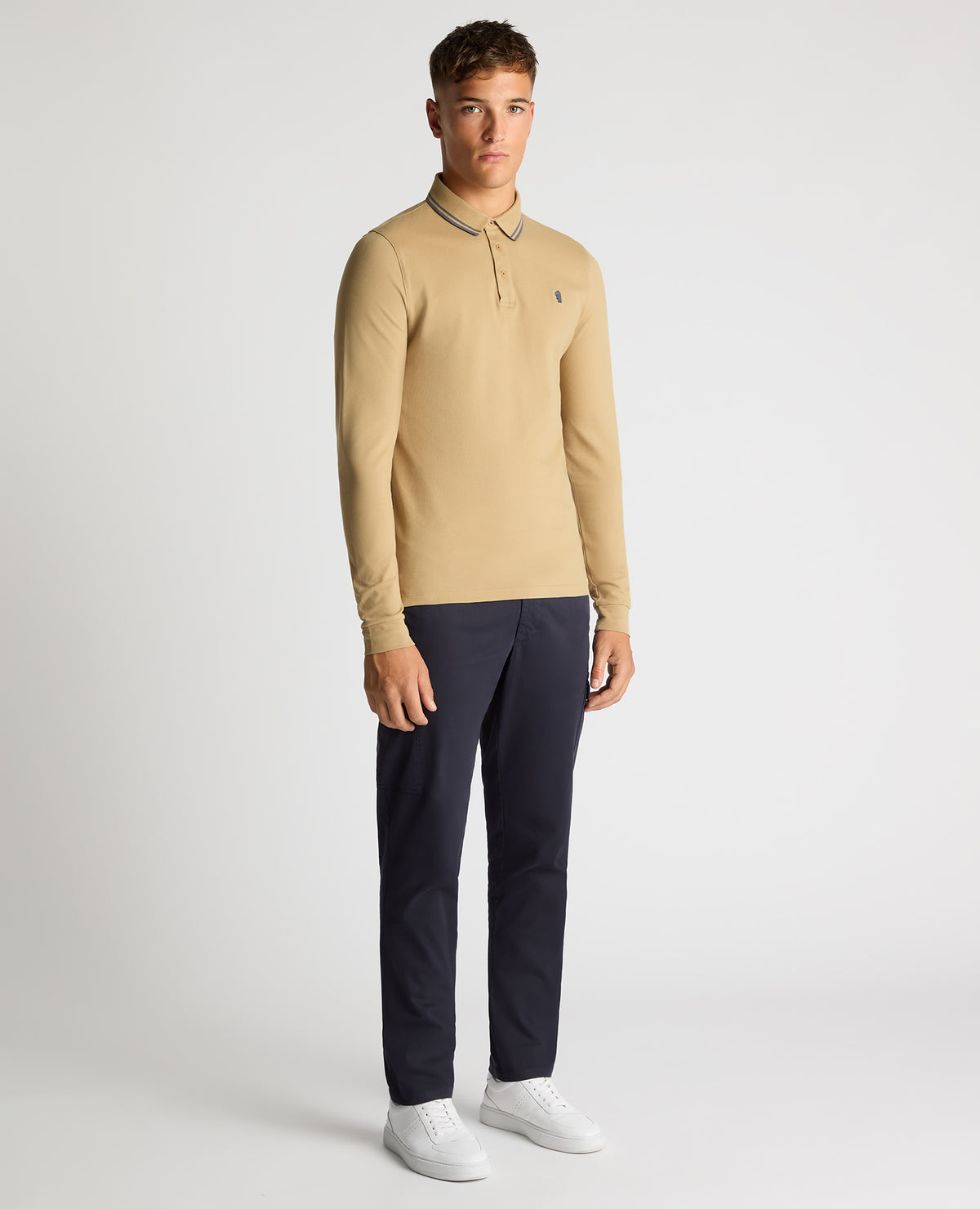 Man wearing a sand Slim Fit Cotton-Stretch Pique Polo Shirt