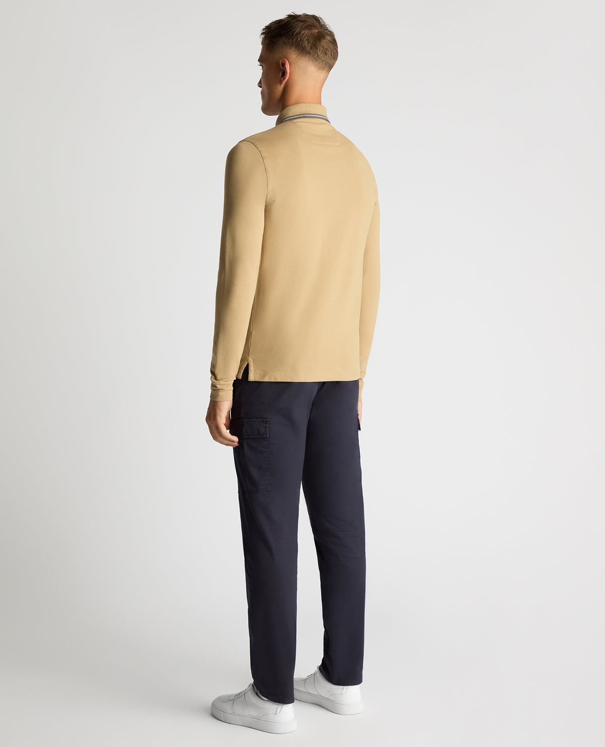 Man wearing a sand Slim Fit Cotton-Stretch Pique Polo Shirt