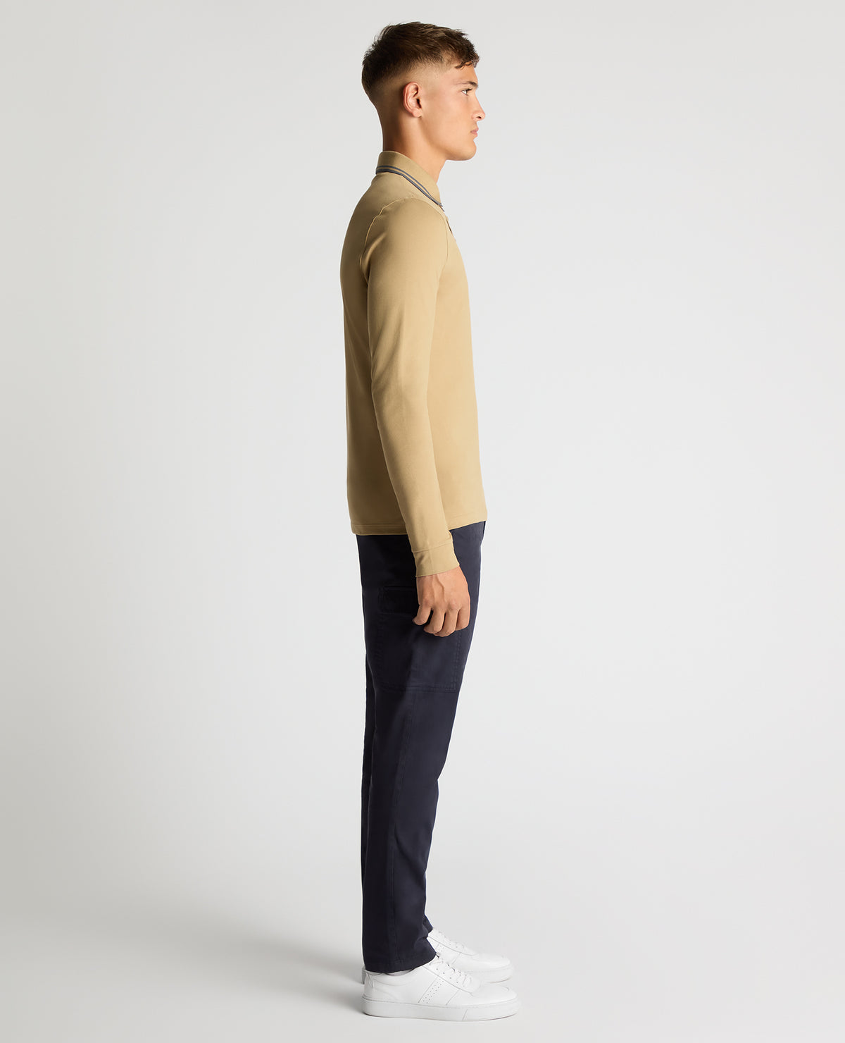 Man wearing a sand Slim Fit Cotton-Stretch Pique Polo Shirt