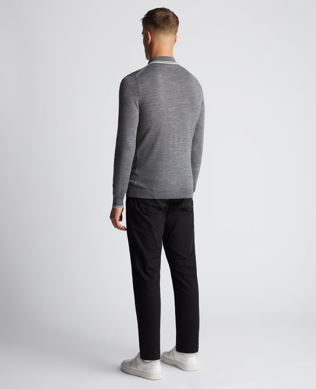 Man wearing a grey Slim Fit Merino Wool Knitted Polo