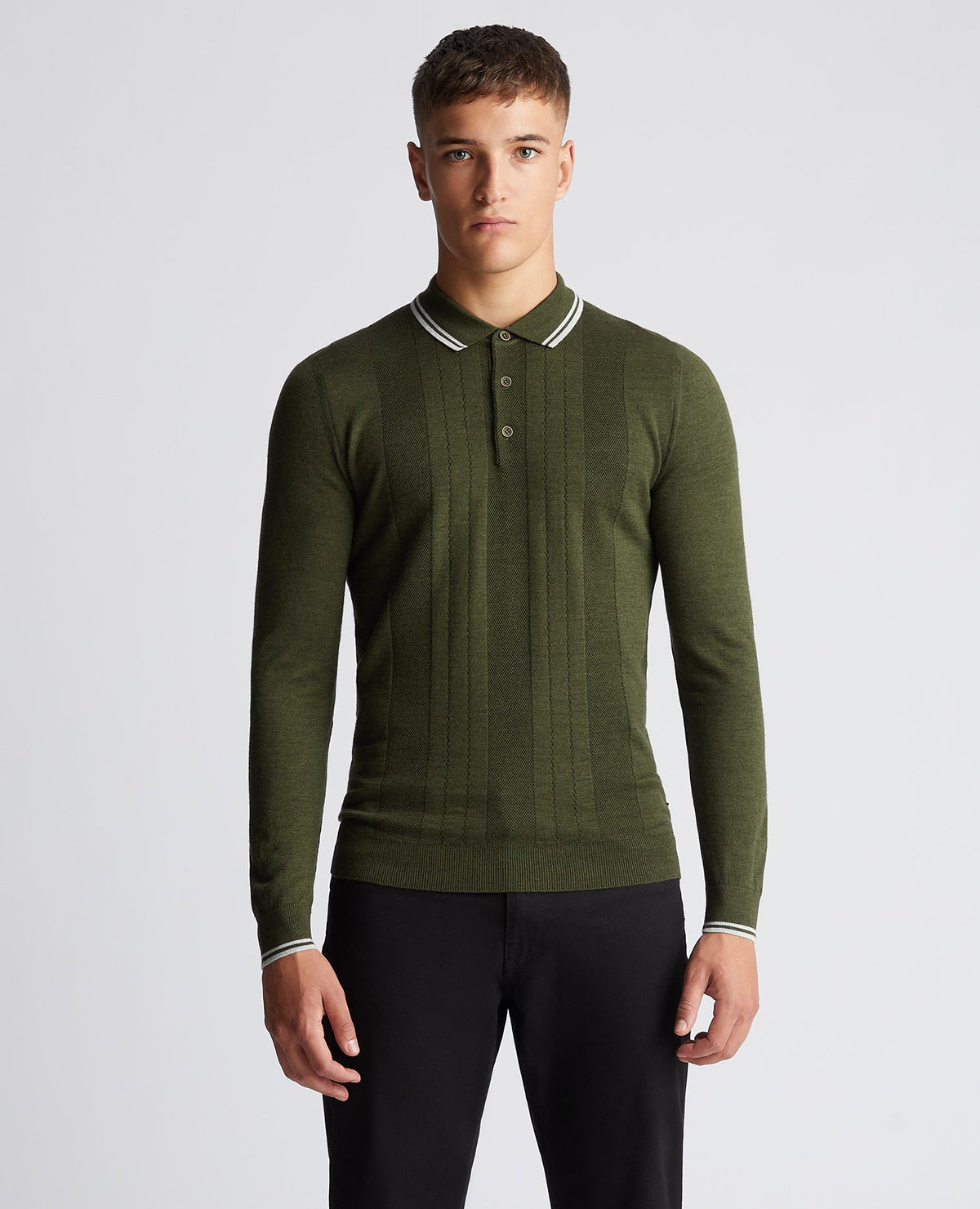 Man wearing a green Slim Fit Merino Wool-Blend Long Sleeve Knitted Polo