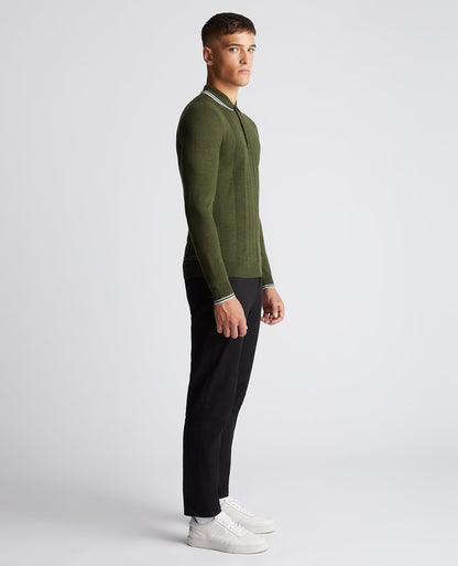 Man wearing a green Slim Fit Merino Wool-Blend Long Sleeve Knitted Polo