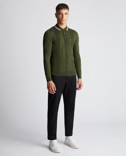 Man wearing a green Slim Fit Merino Wool-Blend Long Sleeve Knitted Polo