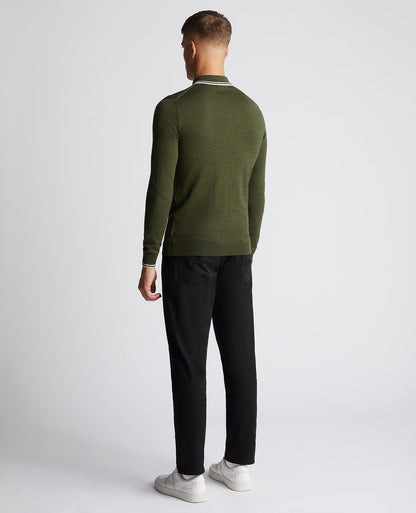 Man wearing a green Slim Fit Merino Wool-Blend Long Sleeve Knitted Polo