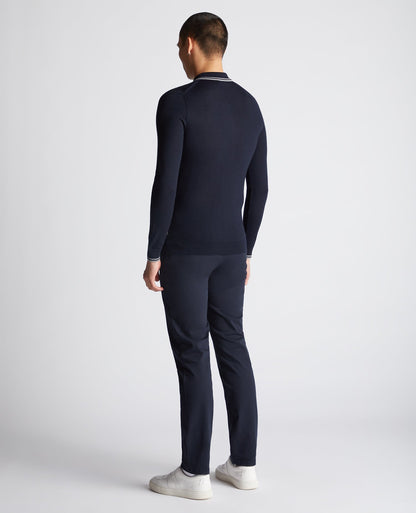 Man wearing a navy Slim Fit Merino Wool Knitted Polo
