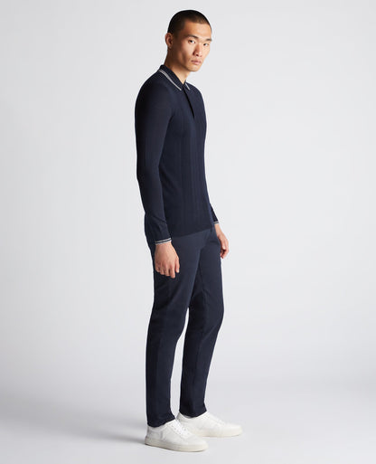 Man wearing a navy Slim Fit Merino Wool Knitted Polo