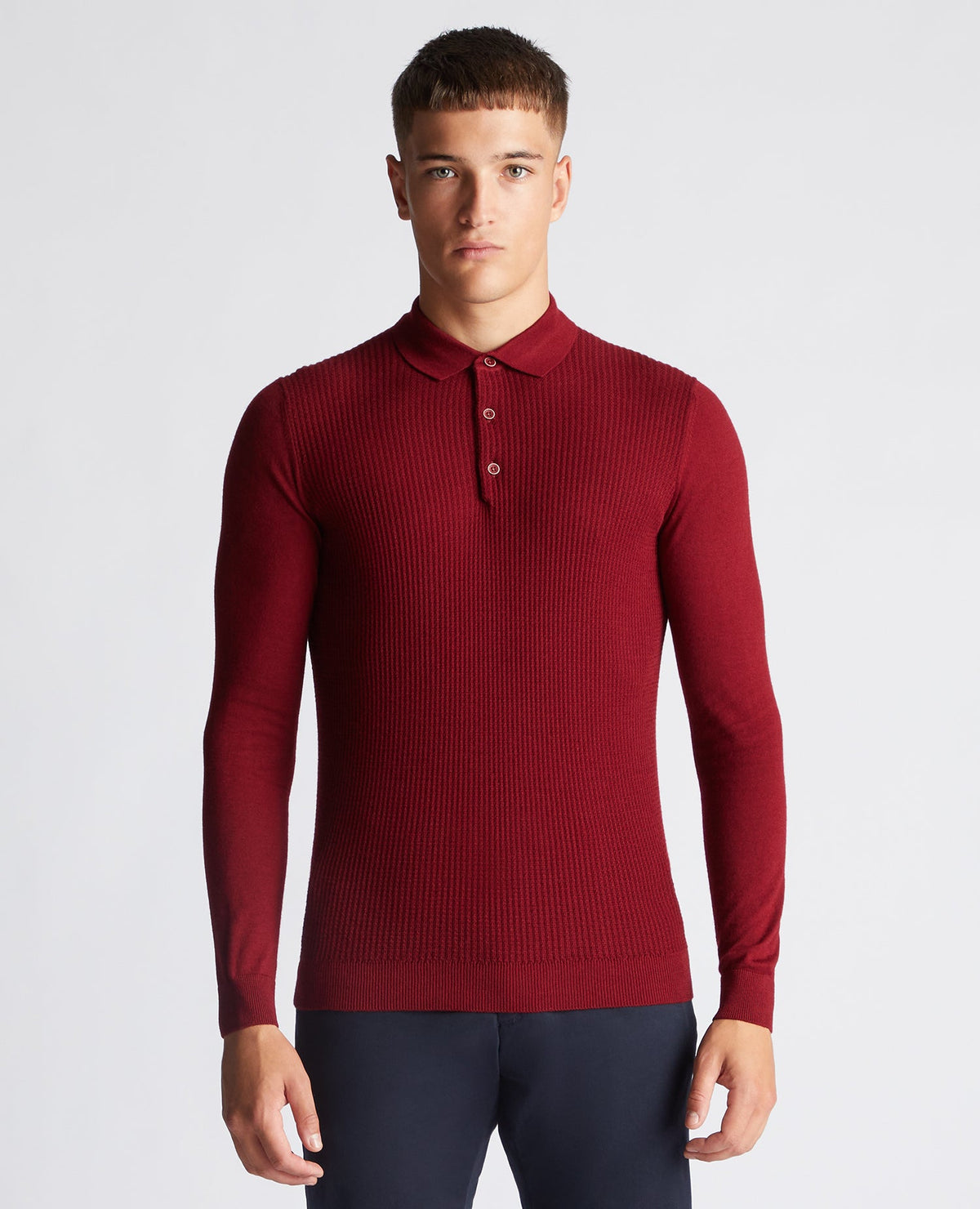 Man wearing a red Slim Fit Merino Wool-Blend Long Sleeve Knitted Polo