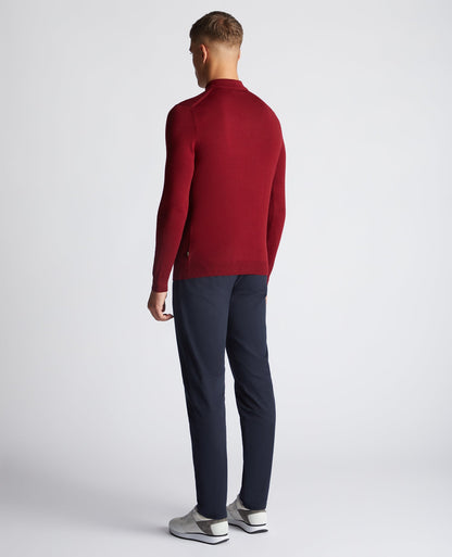 Man wearing a red Slim Fit Merino Wool-Blend Long Sleeve Knitted Polo