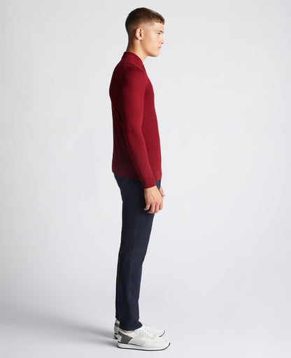 Man wearing a red Slim Fit Merino Wool-Blend Long Sleeve Knitted Polo