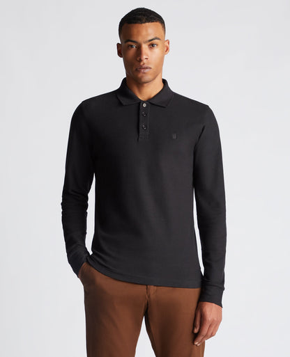 Man wearing a black Slim Fit Cotton-Stretch Pique Polo Shirt
