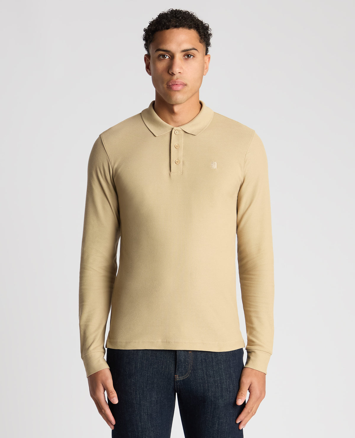 Man wearing a sand Slim Fit Cotton-Stretch Pique Polo Shirt