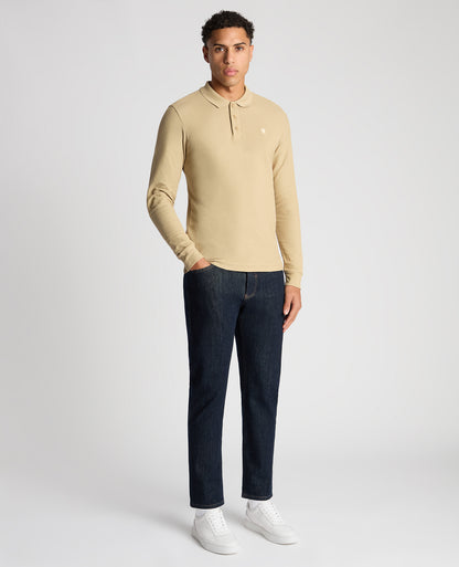 Man wearing a sand Slim Fit Cotton-Stretch Pique Polo Shirt