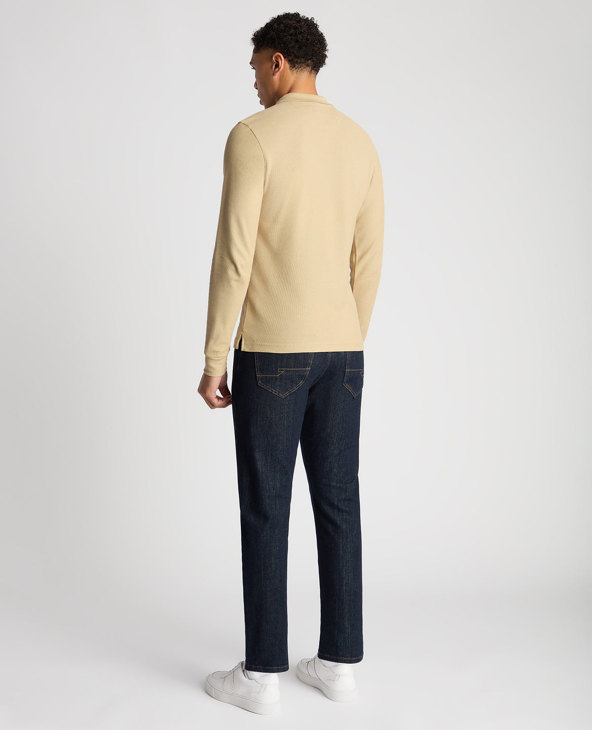 Man wearing a sand Slim Fit Cotton-Stretch Pique Polo Shirt